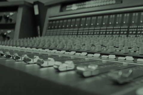 Close up image of a mixing console